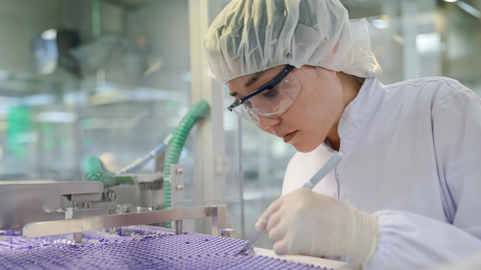 Jia Xiao Jing, Operator, doing quality control in the packaging department, Beijing, China